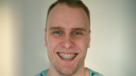 close up of young man's face with a contented smile