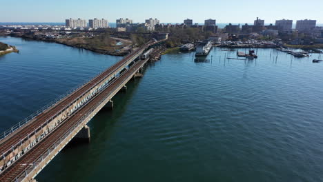 an aerial shot over grassy bay in queens, ny