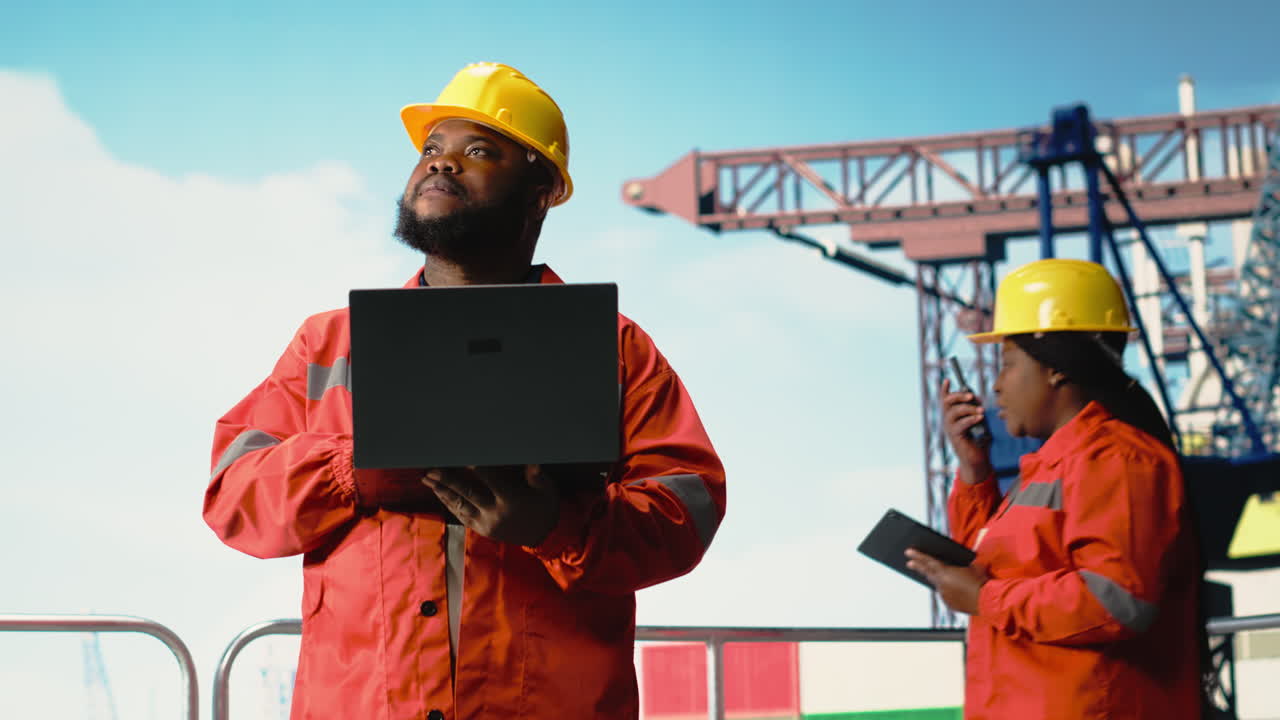 Vertical video Man working for industrial offshore platform monitoring operations