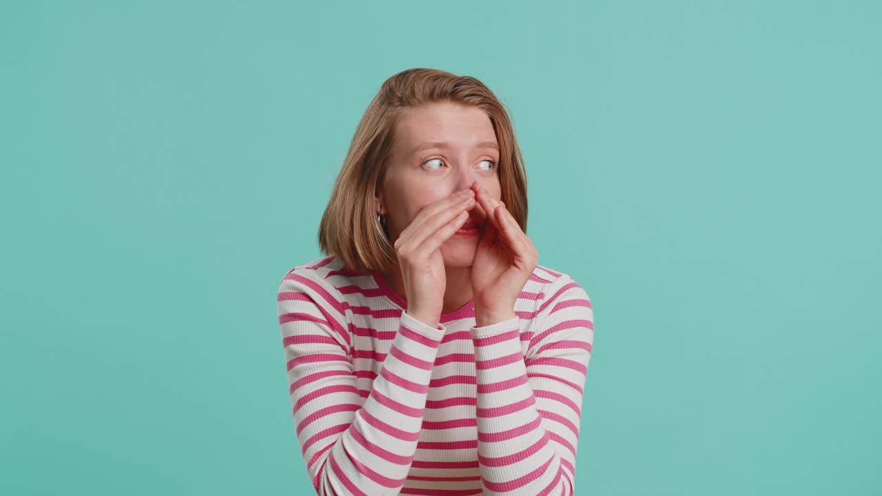 Young woman whisper news rumors holding hands near mouth share gossip quiet keep my secrets