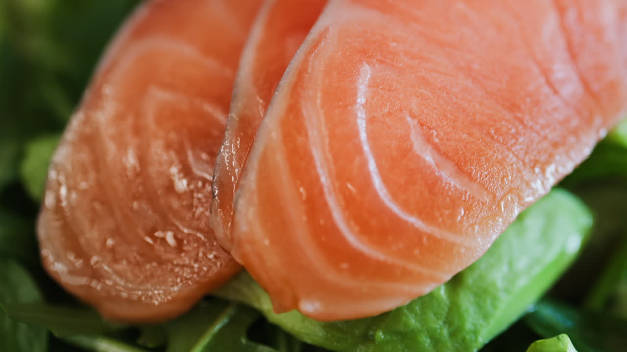 Close up of a quinoa salad with salmon and spinach at a restaurant