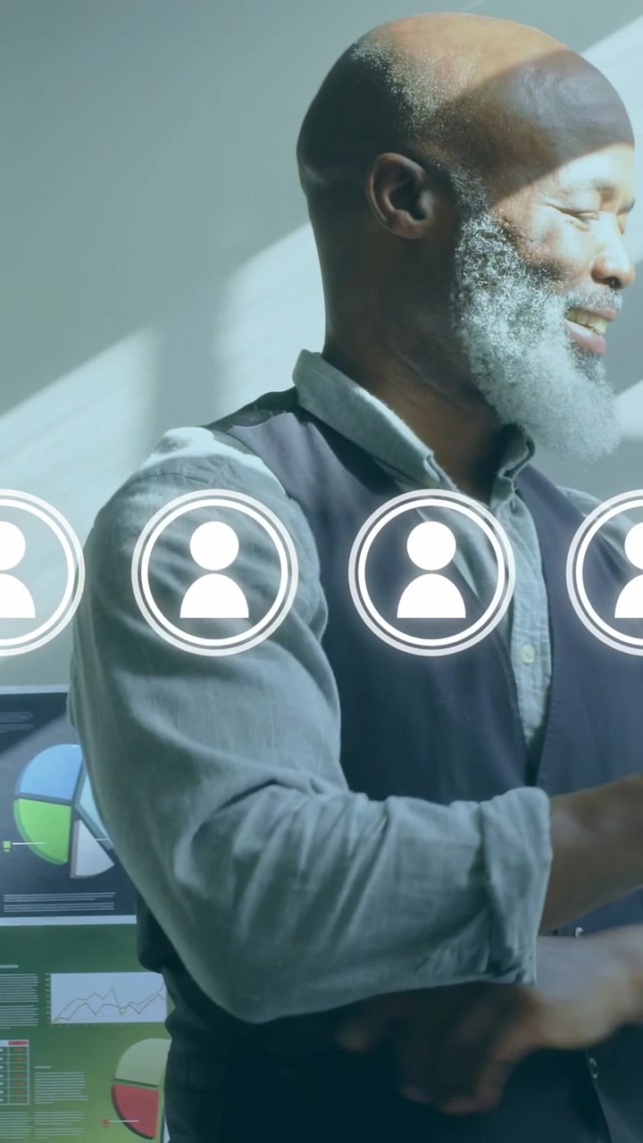 Vertical video: Man entering right, pausing by charts, reviewing business data with overlaid icons