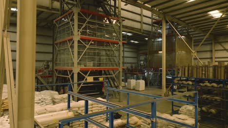 textile mill warehouse with equipment and raw materials, karachi, slow motion gimbal shot