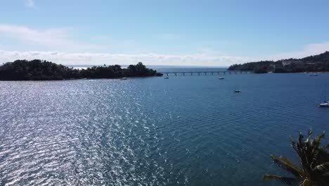 Aerial-view-of-tropical-beach-of-samana,-showing-beautiful-mountain-scenery