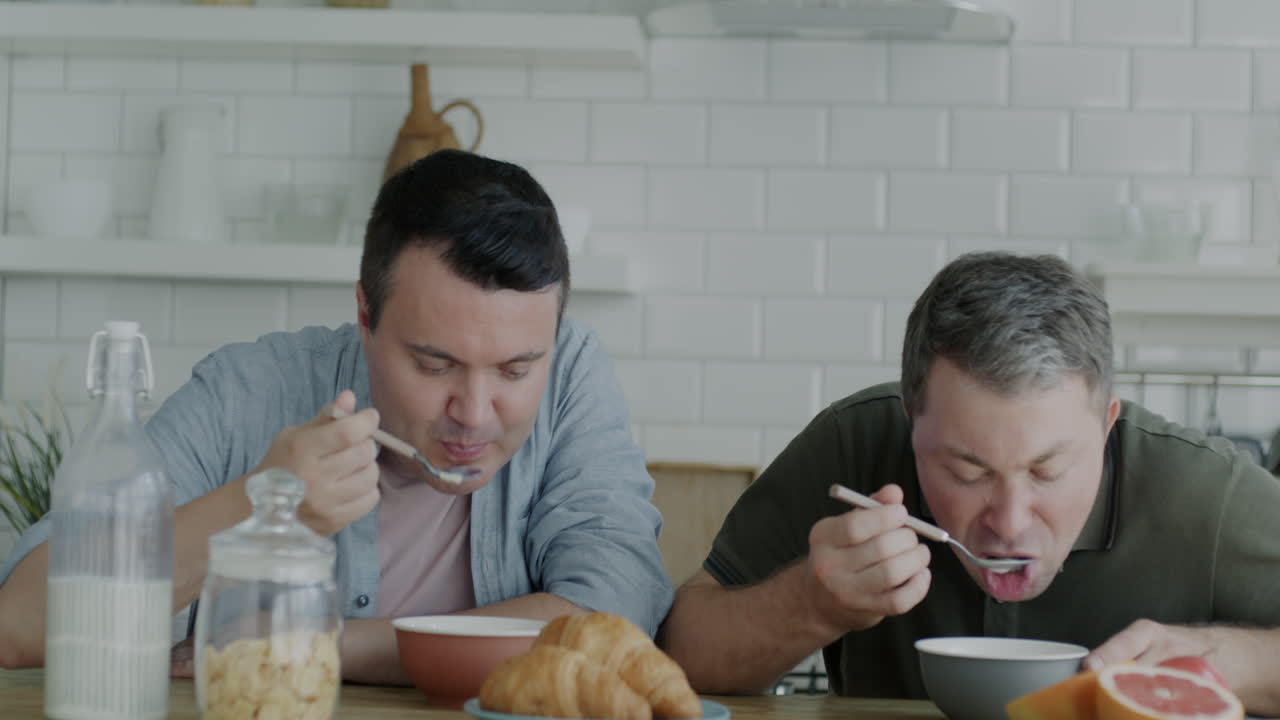 Two Men Enjoying Breakfast Together