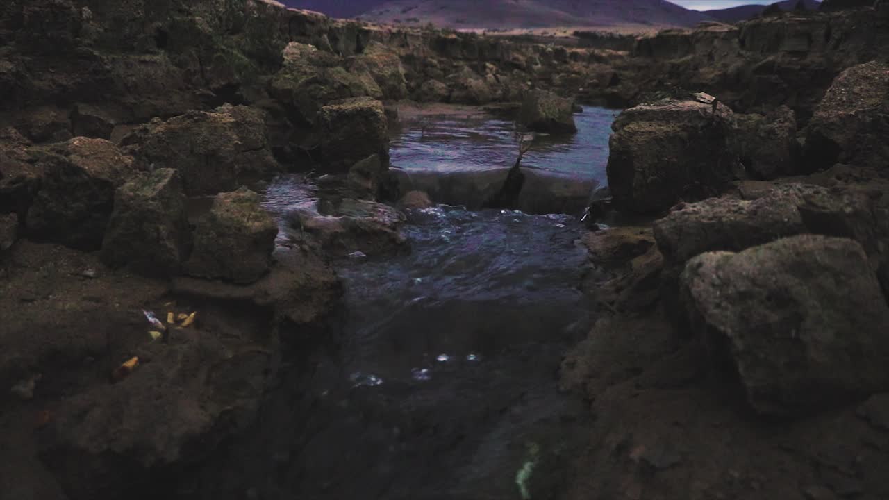 Canyon and a river passing through. Narrow steep rocky ravine. Natural landmark.
