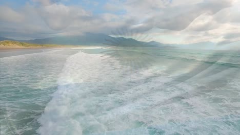 Digital-composition-of-argentina-flag-waving-against-aerial-view-of-waves-in-the-sea