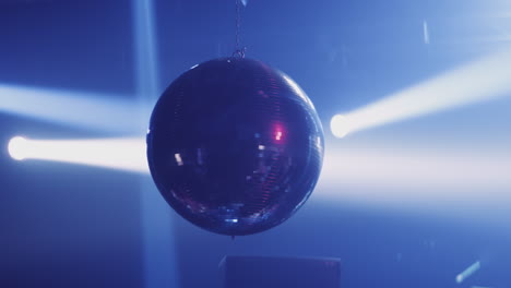 disco ball under stage lights