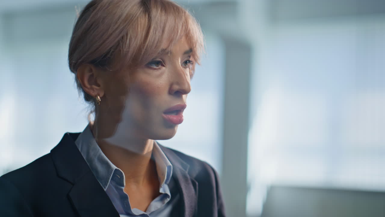 Irritated lady arguing smartphone discussing work trouble in office closeup