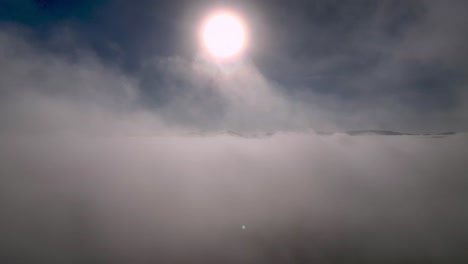 aerial dramatic flight through clouds and cloud ceiling near wilkesboro nc, north carolina