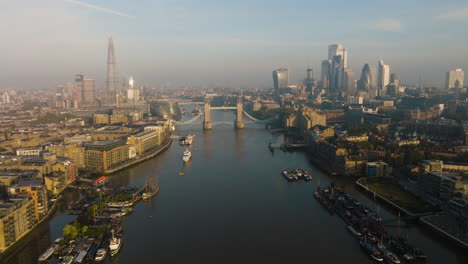 london cityscape from above, featuring tower bridge and river thames
