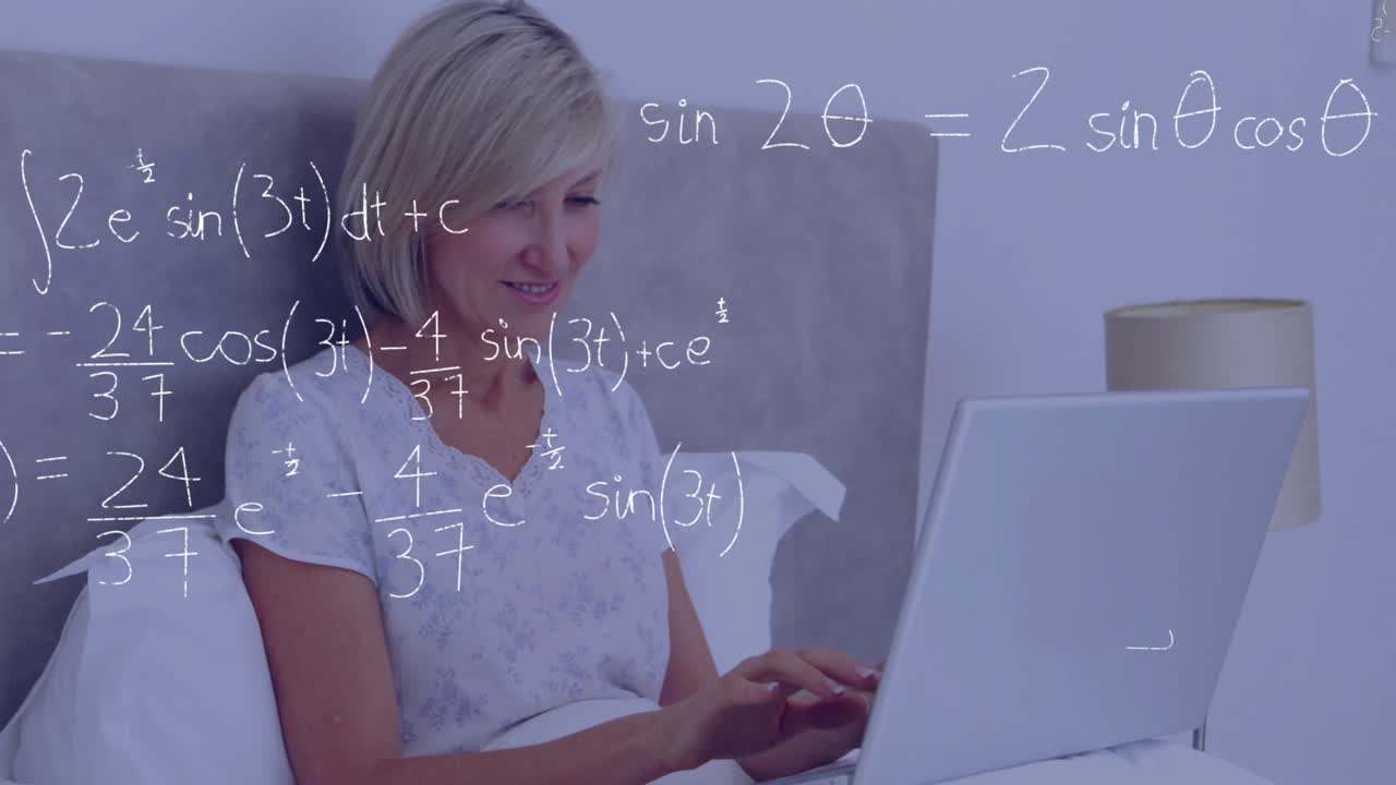 Using laptop in bed, woman surrounded by mathematical equations animation
