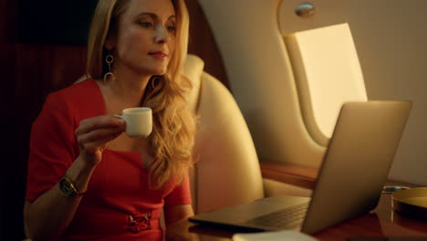 smiling businesswoman traveling corporate jet closeup. luxury lady resting alone