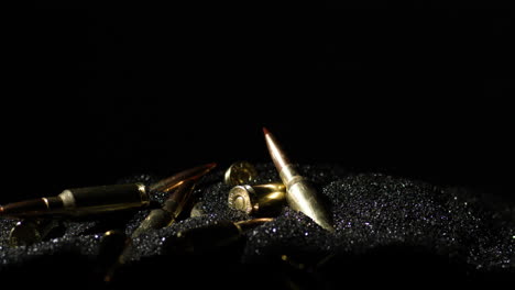 6mm arc rifle cartridge lay down on heap of smokeless powder