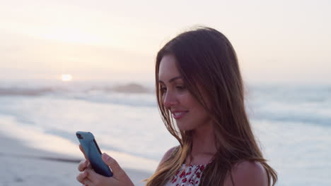 Phone-selfie,-beach-and-profile-of-woman