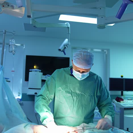 surgical liposuction in modern clinic. professional surgeon conducts a medical procedure on patient's abdomen for removing fat