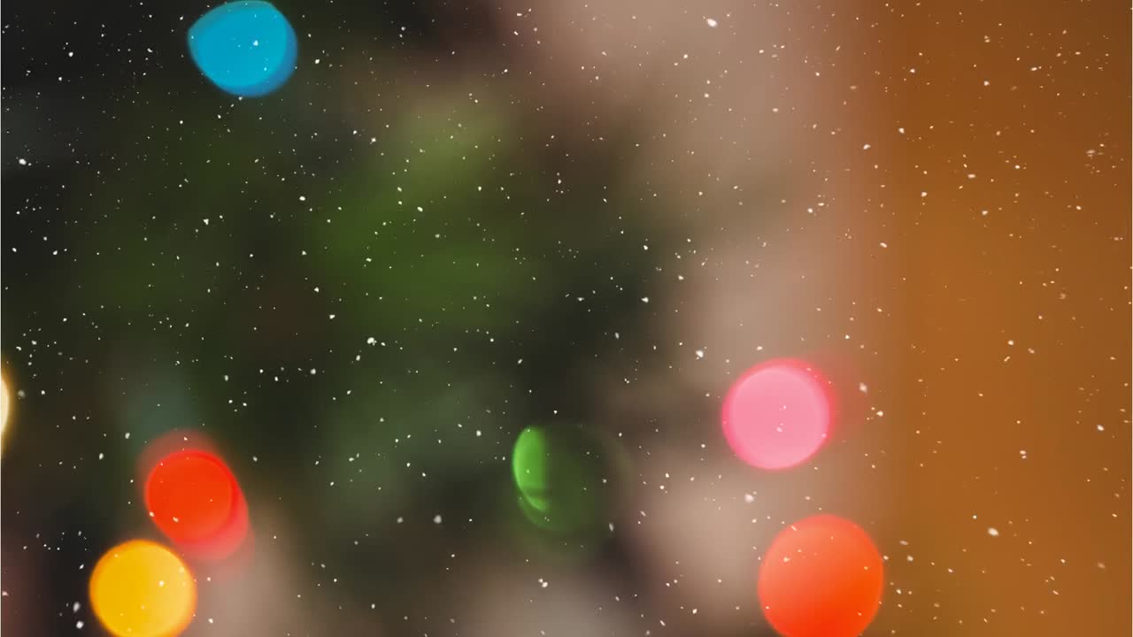 Animation of snow falling over christmas decorations