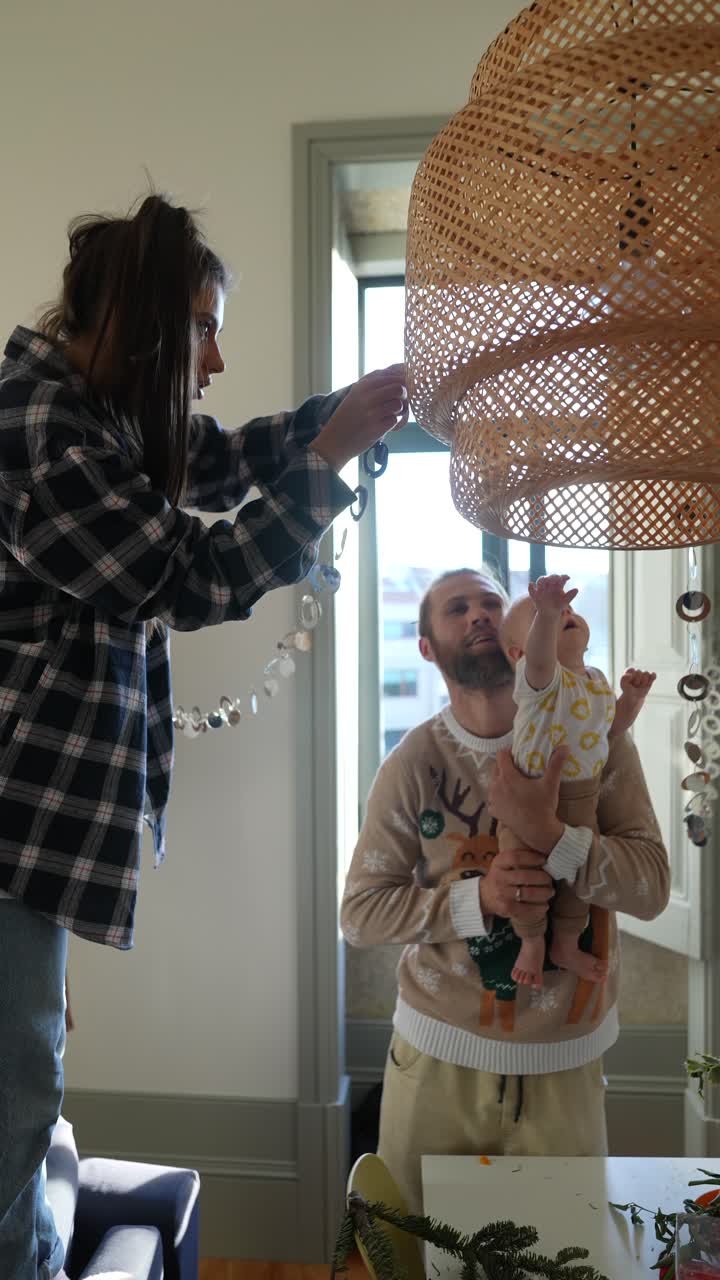 Family Decorating the Home with a Baby
