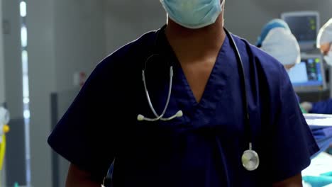 Male-surgeon-standing-at-hospital-4k