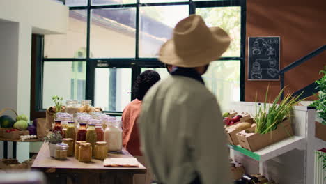 couple asking vendor about fresh produce