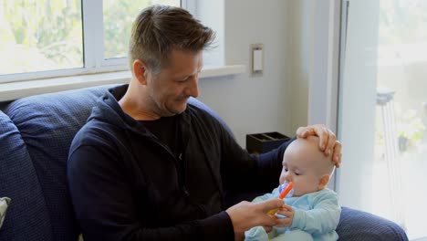 Baby-boy-with-his-father-playing-with-toy-4k