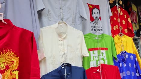 assorted shirts being showcased on a rack