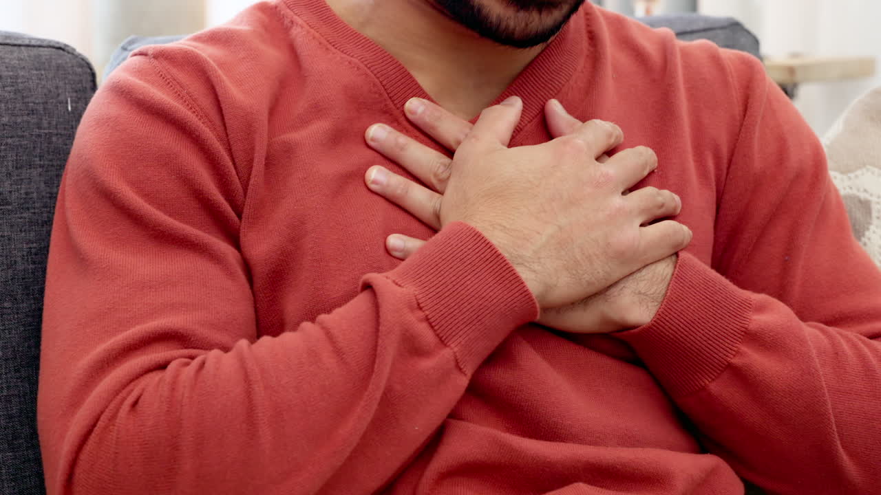 Heart attack, emergency and pain with man holding