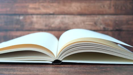 open book on wooden table