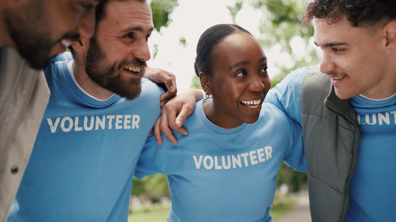Diverse Group of Happy Volunteers Smiling and Talking Outdoors