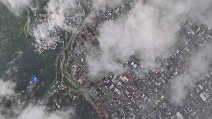 Bogota Colombia Aerial v10 high altitude top down view, drone flyover La Paz, hillside Germania and Santa Fe capturing the neighborhoods above the clouds - Shot with Mavic 3 Cine - November 2022