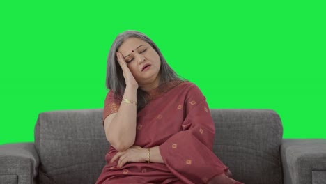 Sick-Indian-old-woman-suffering-from-headache-Green-screen