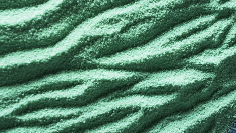 A-close-up-of-a-textured-green-fabric,-with-copy-space