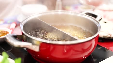 simmering hotpot with divided broth sections