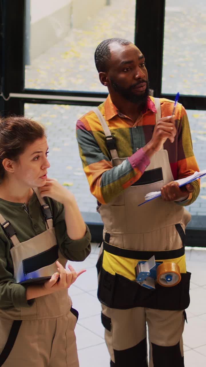 Vertical video: Diverse employees checking products list