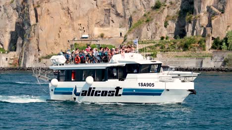 a boat with tourists near sorrento pier