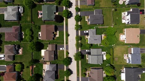top down aerial view of residential homes built neatly in american suburb, usa