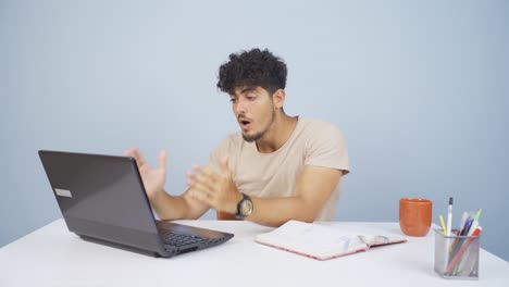 Man-looking-at-laptop-in-amazement.