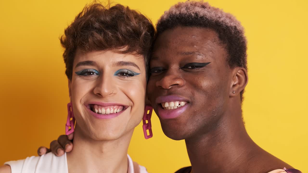 Happy transgender men smiling and embracing
