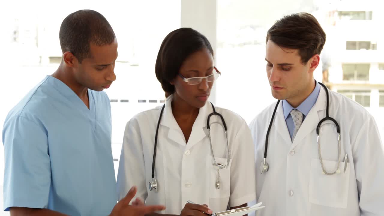 Happy medical team speaking about file