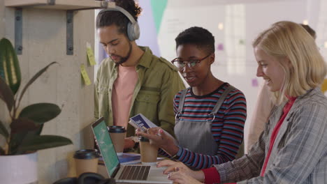 young business people brainstorming african american team leader woman showing support helping colleagues sharing ideas using laptop computer in modern office workplace