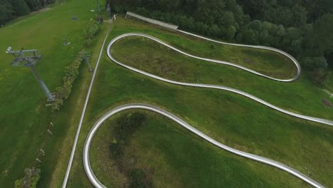 a summer toboggan track on top of a mountain in a tourist town in poland