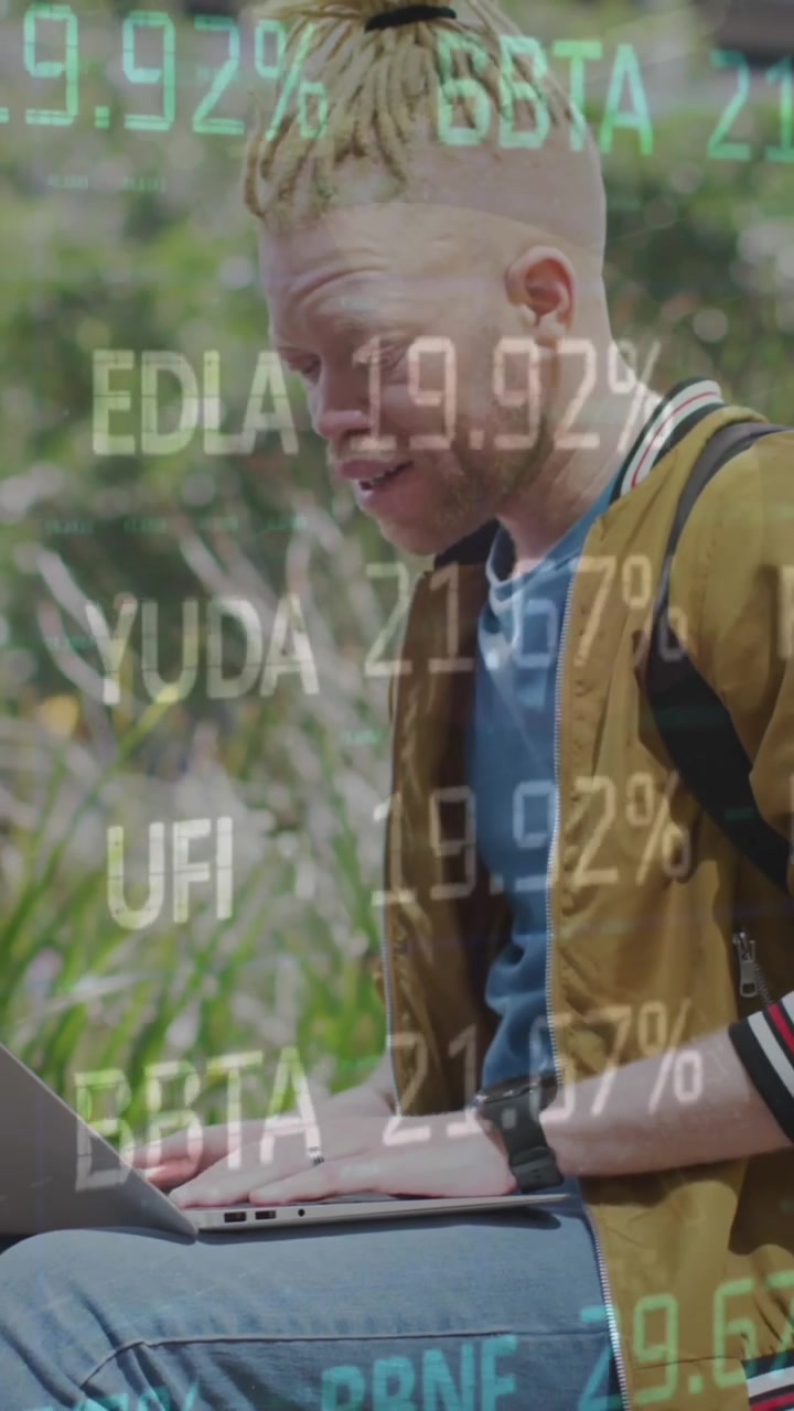 Animation of stock market data moving over african american man with albino using laptop