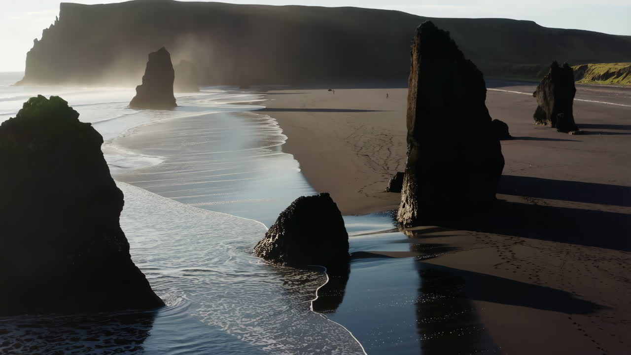 Dramatic Black Sand Beach with Sea Stacks at Sunrise or Sunset