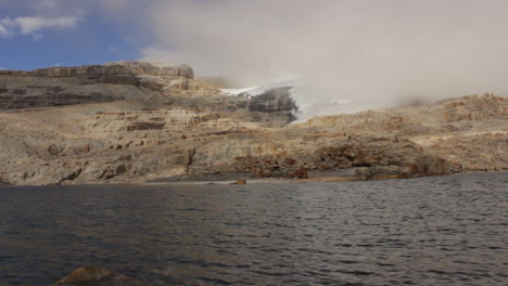 timelapse of andes landscape with a lake water and clouds moving