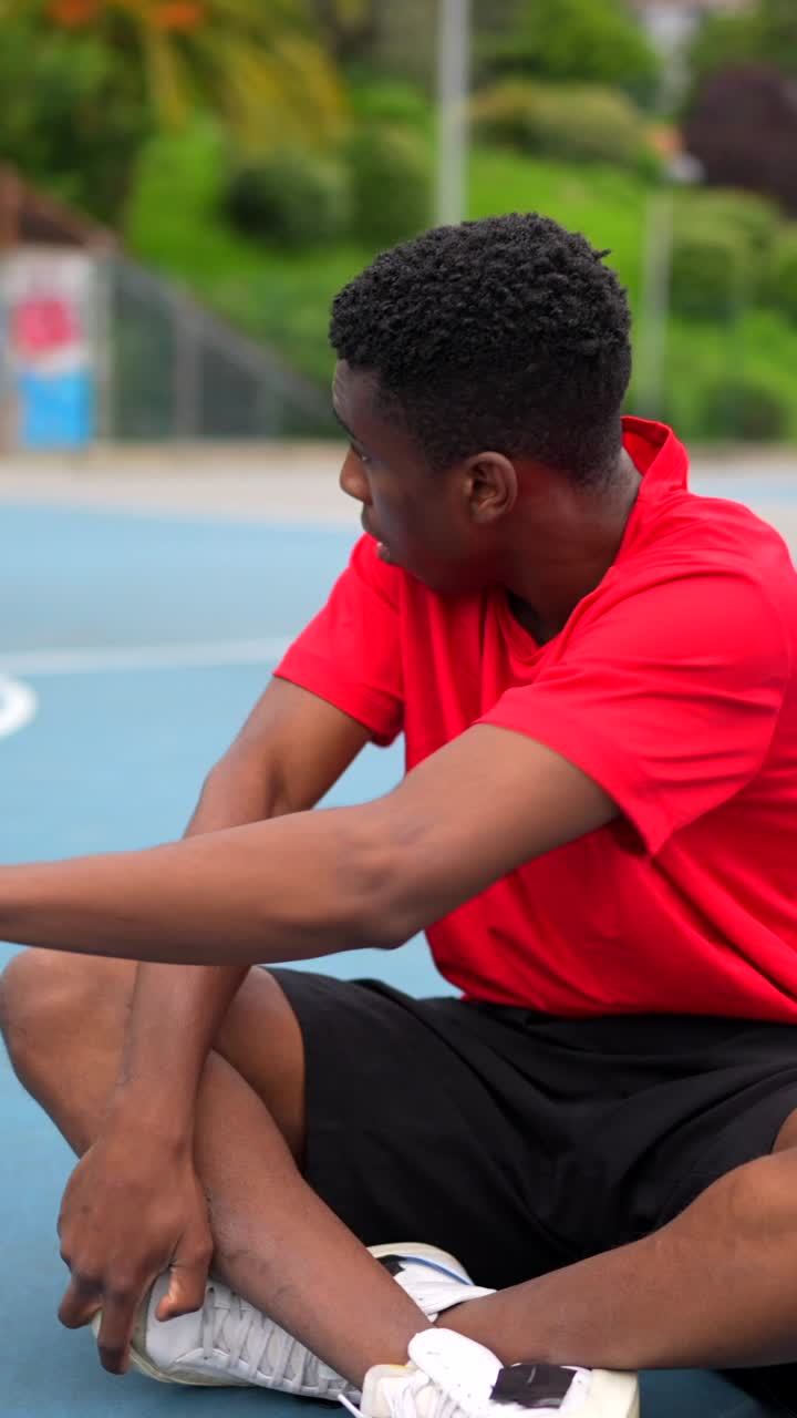 Man Stretching on Court