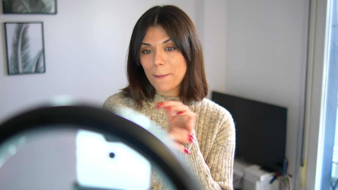 Woman using a ring light for vlogging