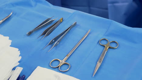 surgical instruments on table in operating theatre at hospital, close up