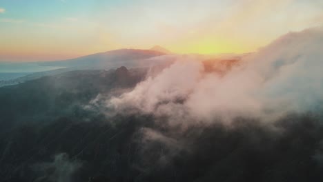 Breathtaking-Aerial-Pan-of-Rolling-Clouds-During-Sunset-in-Anaga-Mountains-Spain