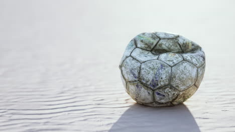 vintage soccer ball on sand