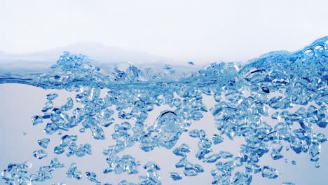 many bubbles in water close up, abstract water wave with bubbles in slow motion